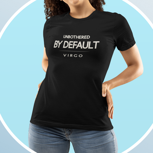 Woman wearing Virgo zodiac t-shirt with “Unbothered By Default” minimalist typography design