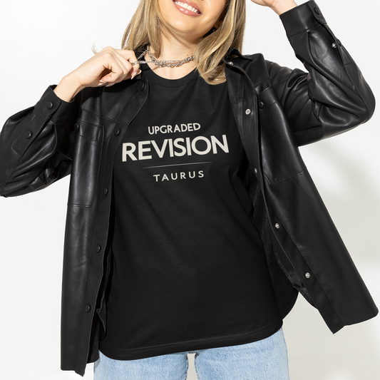Model wearing Taurus zodiac t-shirt with “Upgraded Revision” typography quote