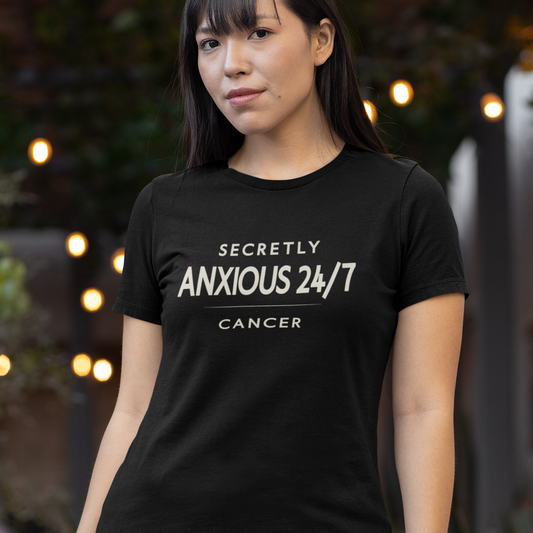 Model wearing Cancer zodiac t-shirt with “Secretly Anxious 24/7” typography quote design