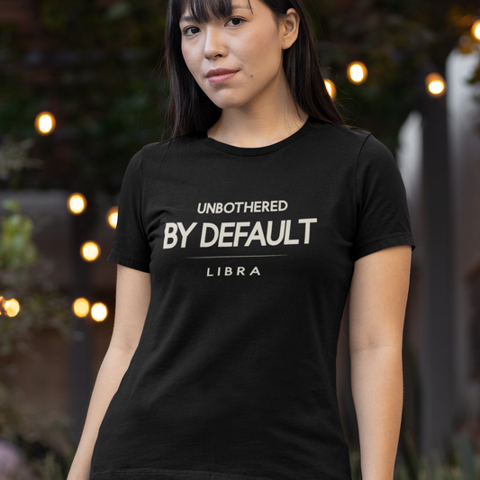 Model wearing Libra zodiac t-shirt with “Unbothered by Default” typography quote design