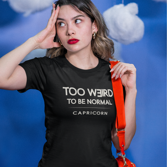 Model wearing Capricorn zodiac t-shirt with “Too Weird to Be Normal” typography quote design