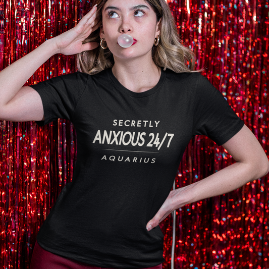 Model wearing Aquarius zodiac t-shirt with secretly anxious 24/7 typography statement design.