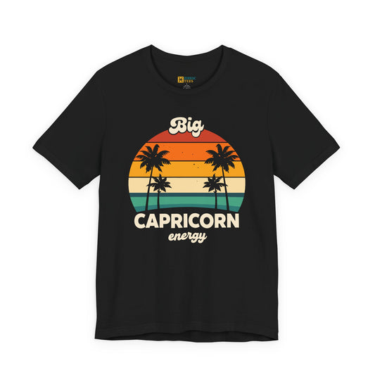 Big Capricorn Energy T-shirt with retro sunset and palm tree graphic on black fabric.