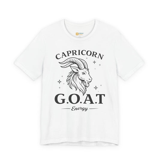 White T-shirt with a black Capricorn G.O.A.T Energy design showing a stylized goat head and stars in a bold vintage style.