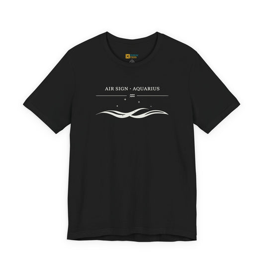 Front view of a black T-shirt with a white minimalist Aquarius design that reads “Air Sign · Aquarius” with a wave graphic and small star details.
