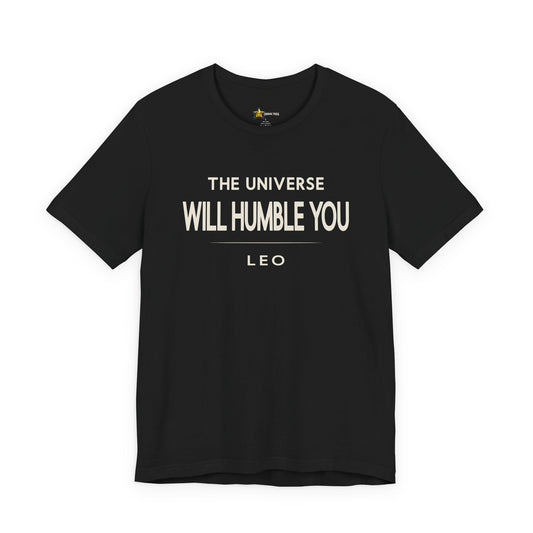 Leo astrology t-shirt with The Universe Will Humble You typography on black background.