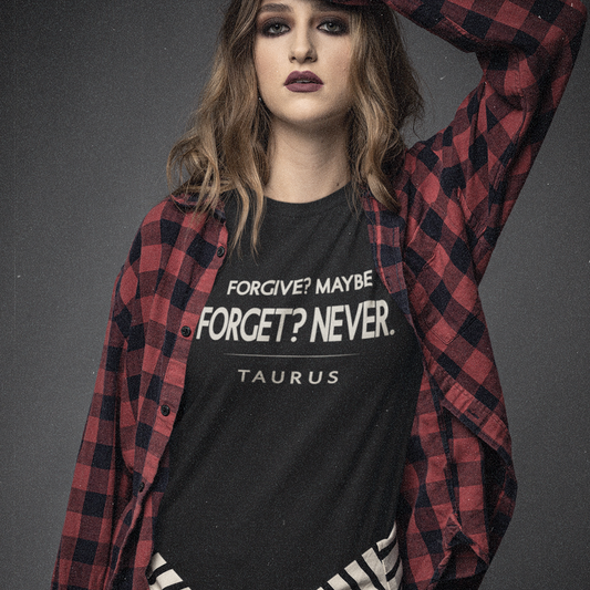 Model wearing Taurus zodiac t-shirt with “Forgive? Maybe. Forget? Never.” bold typography quote design