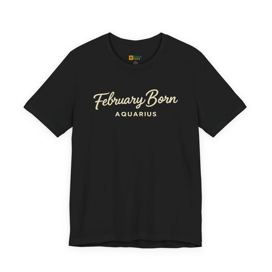 Black T-shirt featuring the text February Born Aquarius in an elegant script font printed across the chest.