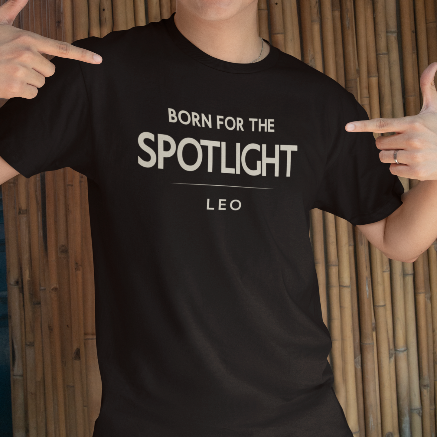 Model wearing Leo zodiac t-shirt with bold “Born for the Spotlight” typography quote