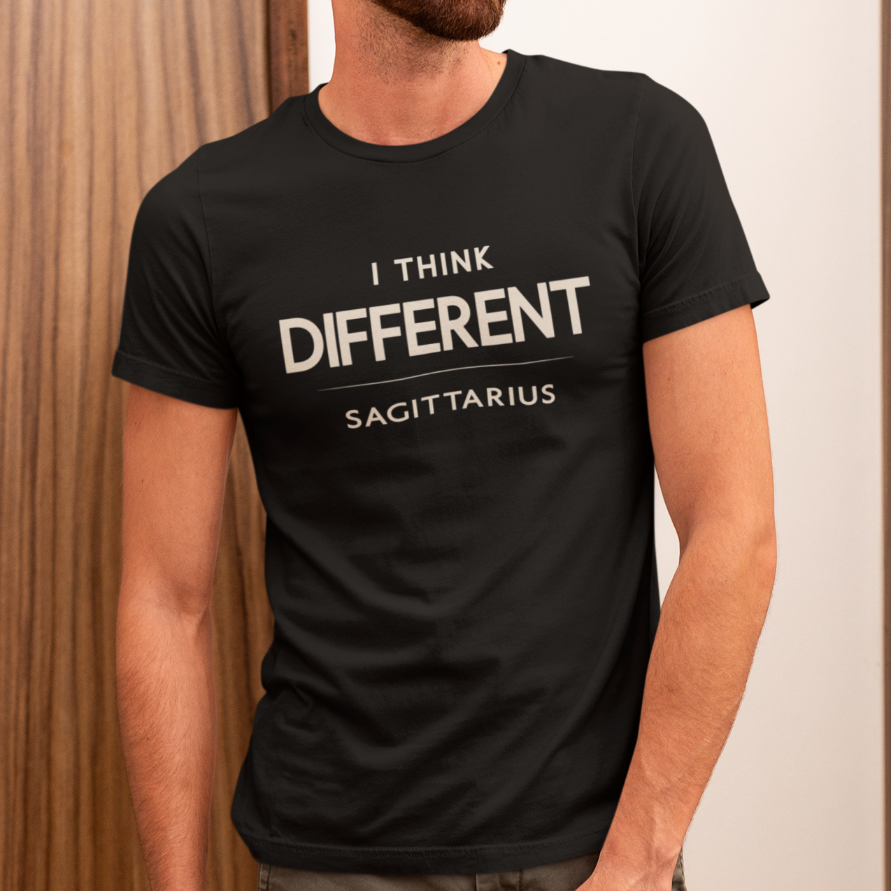 Model wearing Sagittarius zodiac t-shirt with “I Think Different” quote design