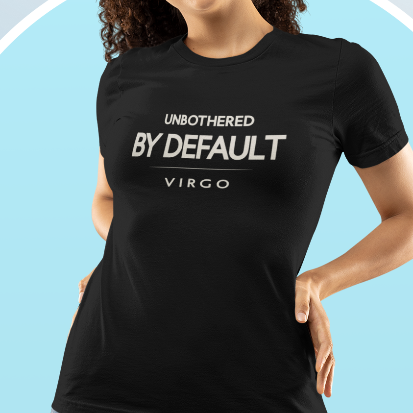 Woman wearing Virgo zodiac t-shirt with “Unbothered By Default” minimalist typography design
