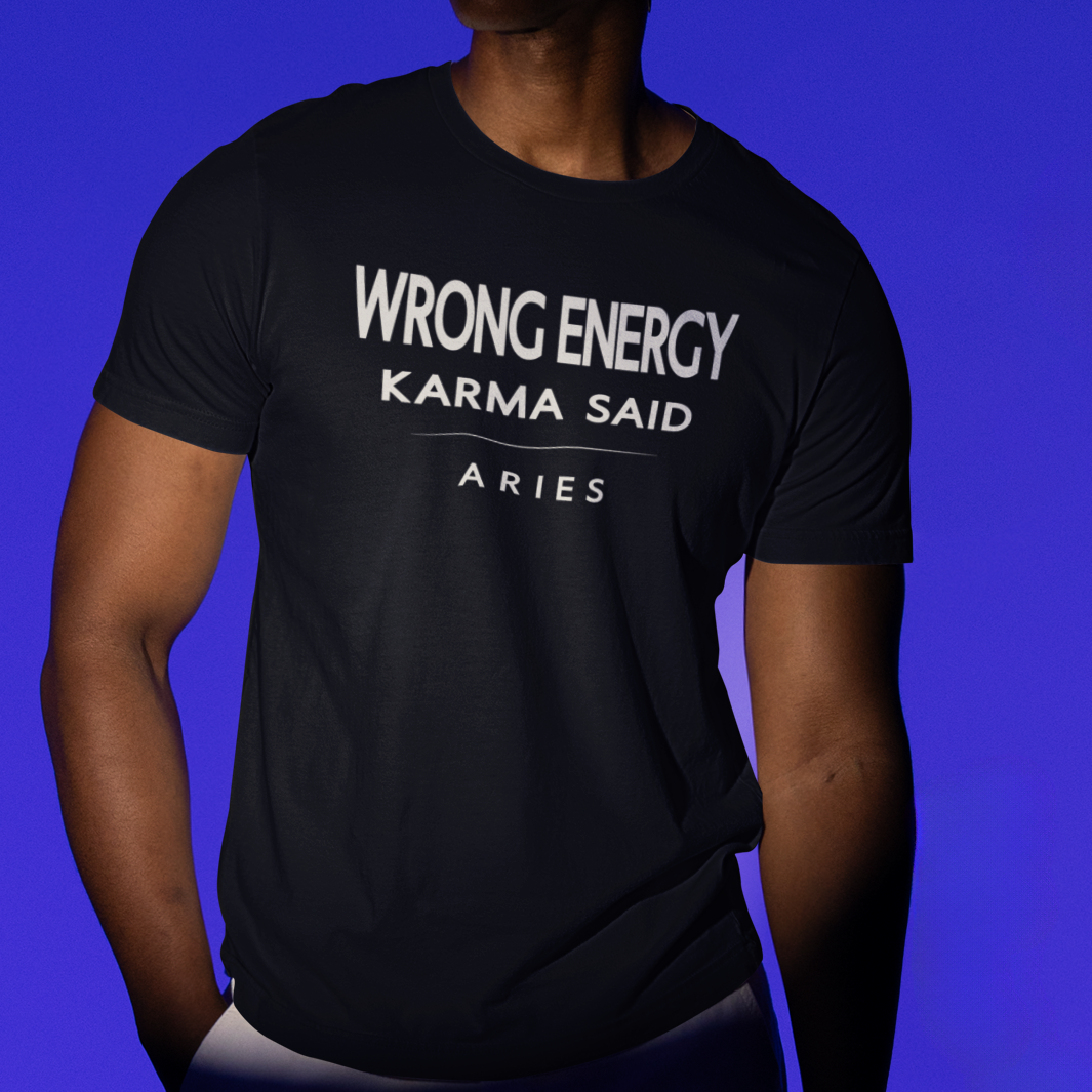 Model wearing Aries zodiac t-shirt with “Wrong Energy Karma Said” typography quote