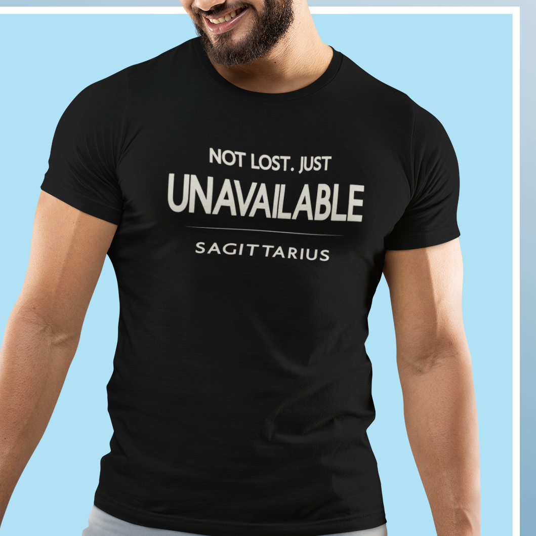 Male model wearing Sagittarius zodiac t-shirt with “Not Lost Just Unavailable” typography quote