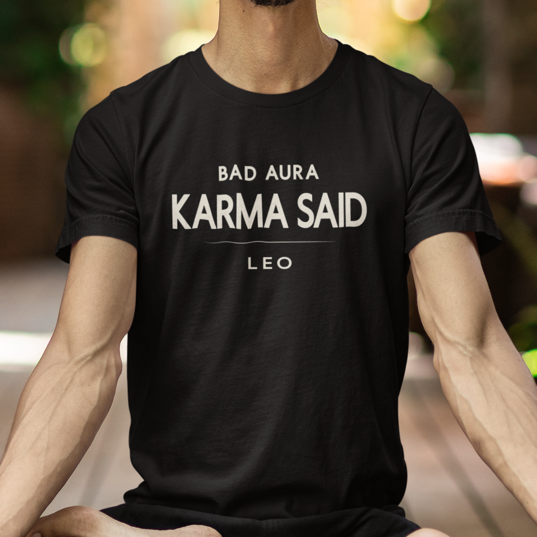 Model wearing Leo zodiac t-shirt with “Bad Aura Karma Said” typography quote