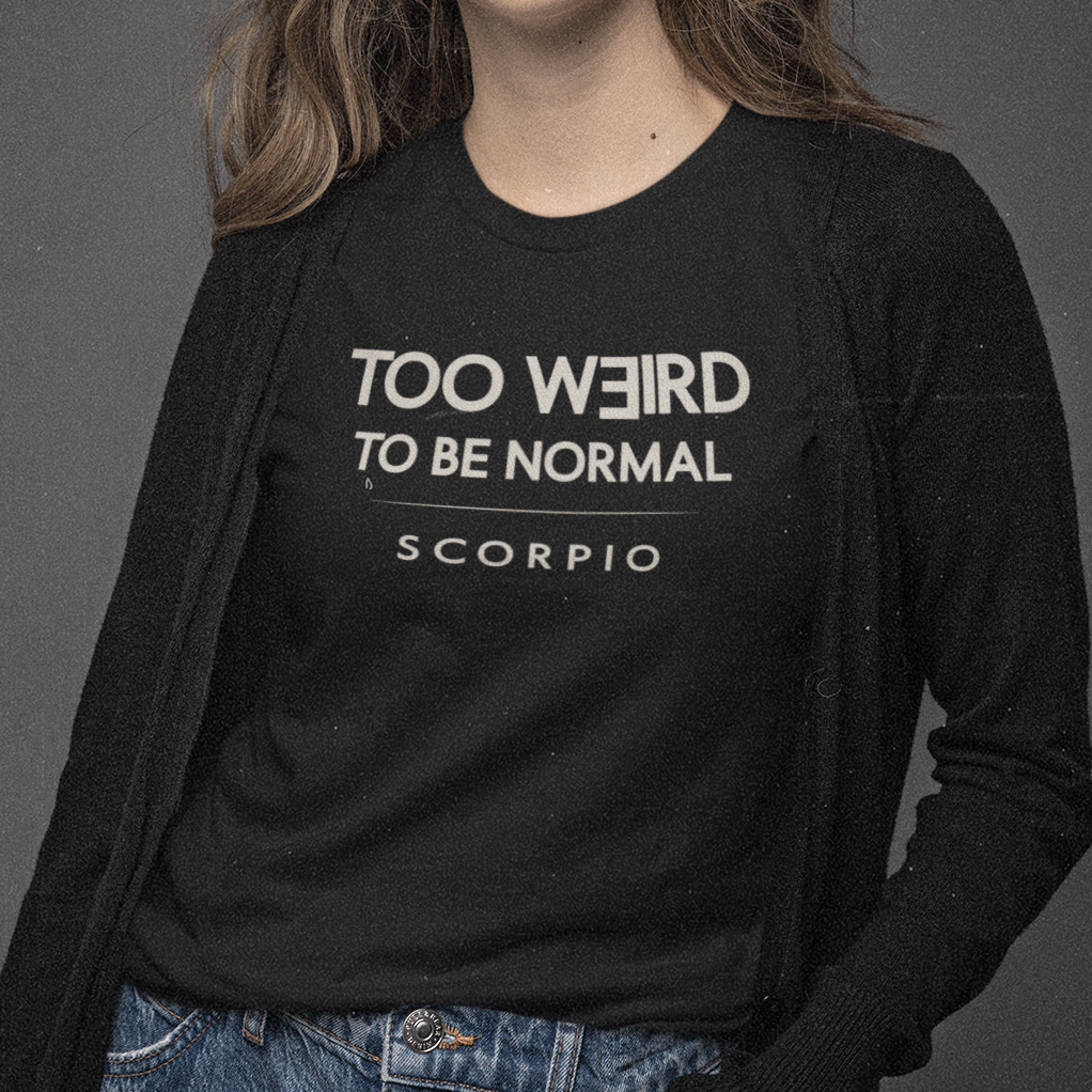 Model wearing Scorpio zodiac t-shirt with “Too Weird to Be Normal” typography quote design