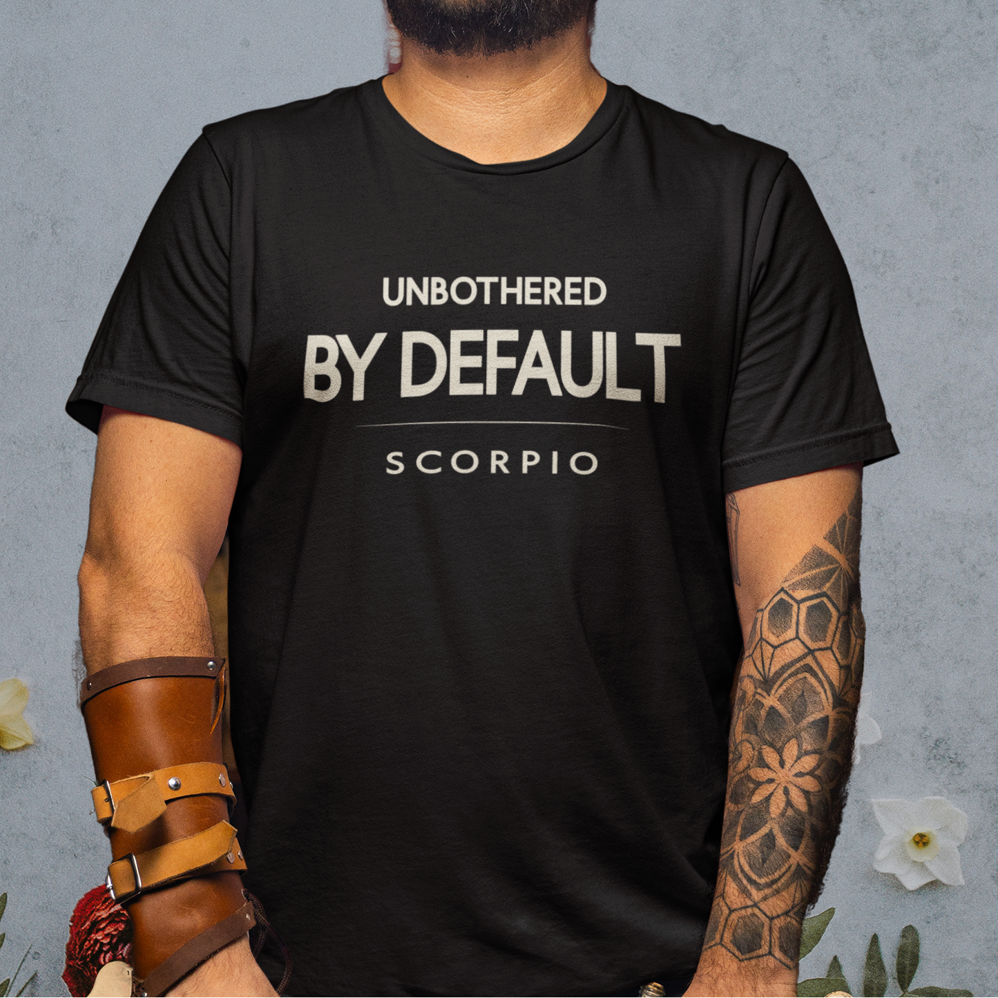 Model wearing Scorpio zodiac t-shirt with “Unbothered by Default” typography quote design