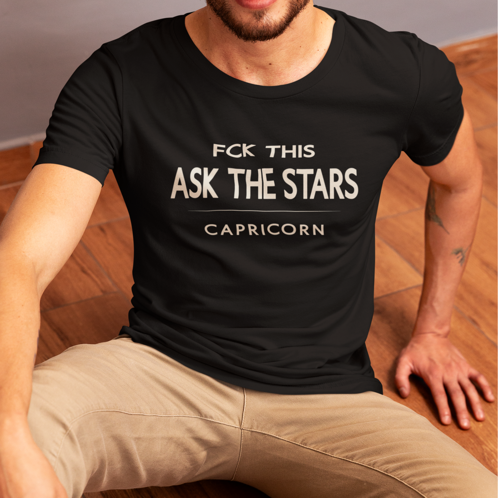 Model wearing Capricorn zodiac t-shirt with “FCK This Ask the Stars” typography quote