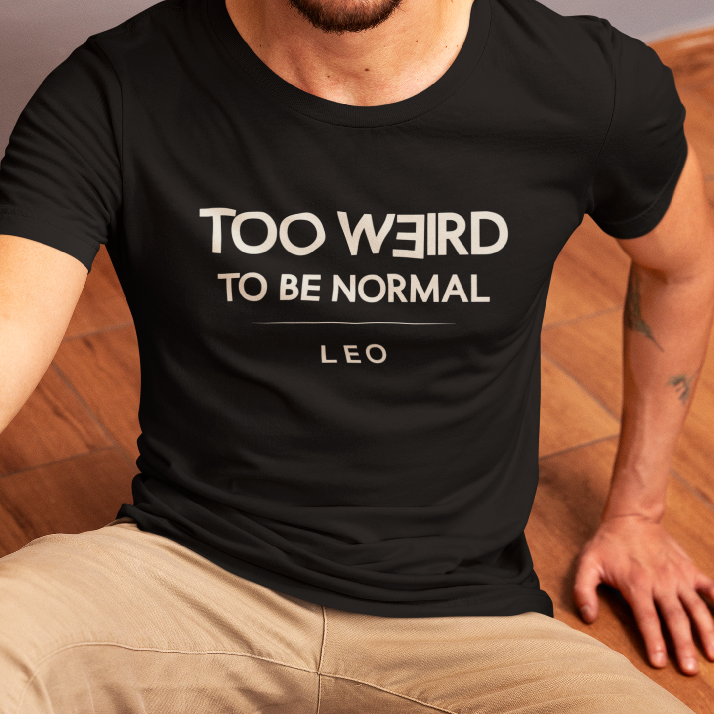 Model wearing Leo zodiac t-shirt with “Too Weird to Be Normal” typography quote design