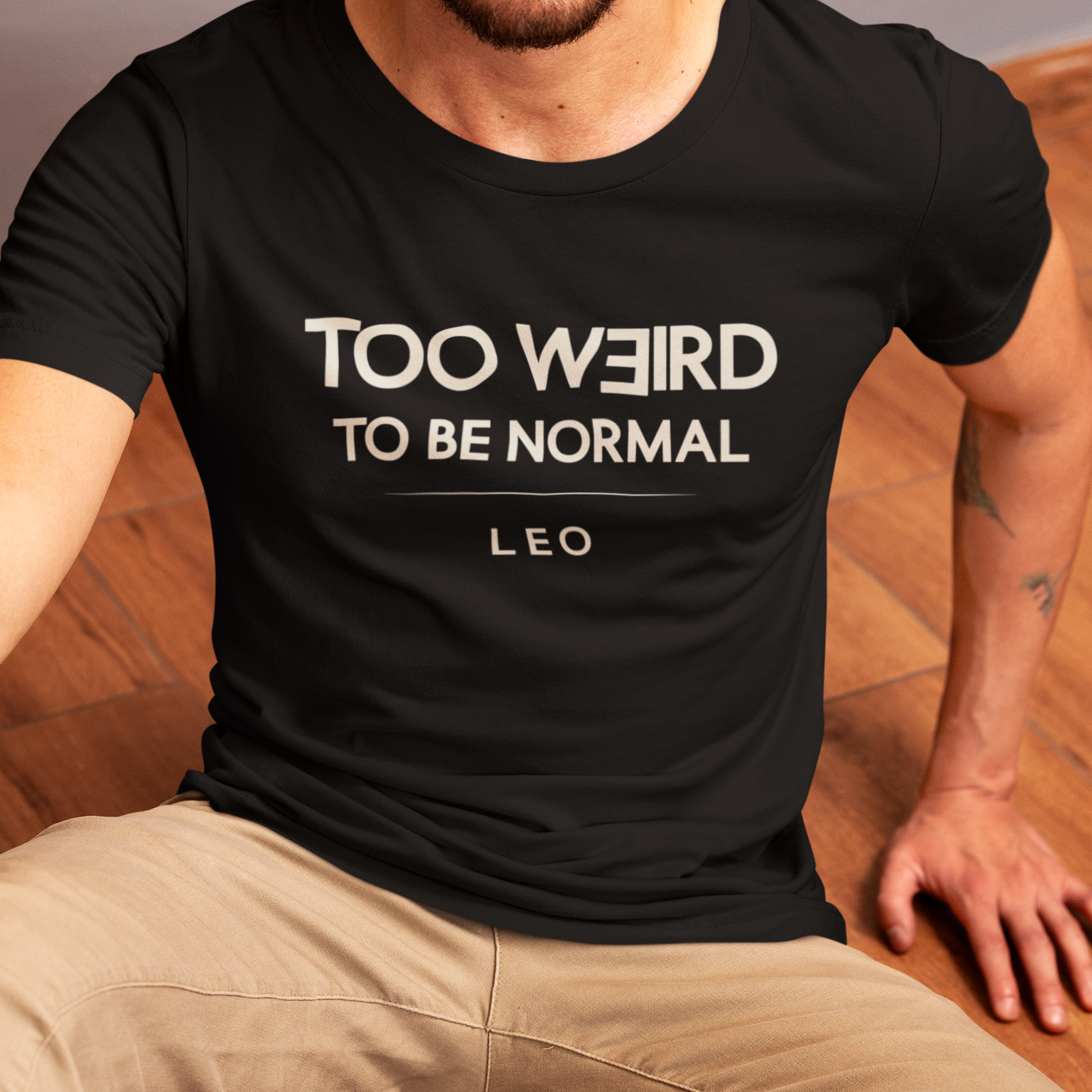 Model wearing Leo zodiac t-shirt with “Too Weird to Be Normal” typography quote design
