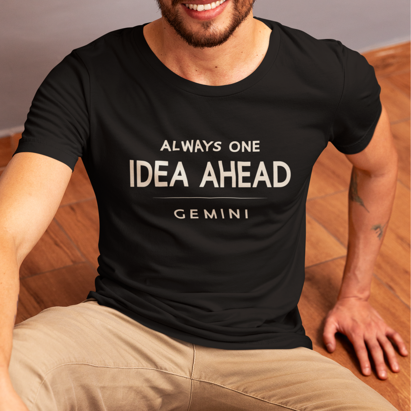 Model wearing Gemini zodiac t-shirt with “Always One Idea Ahead” typography quote