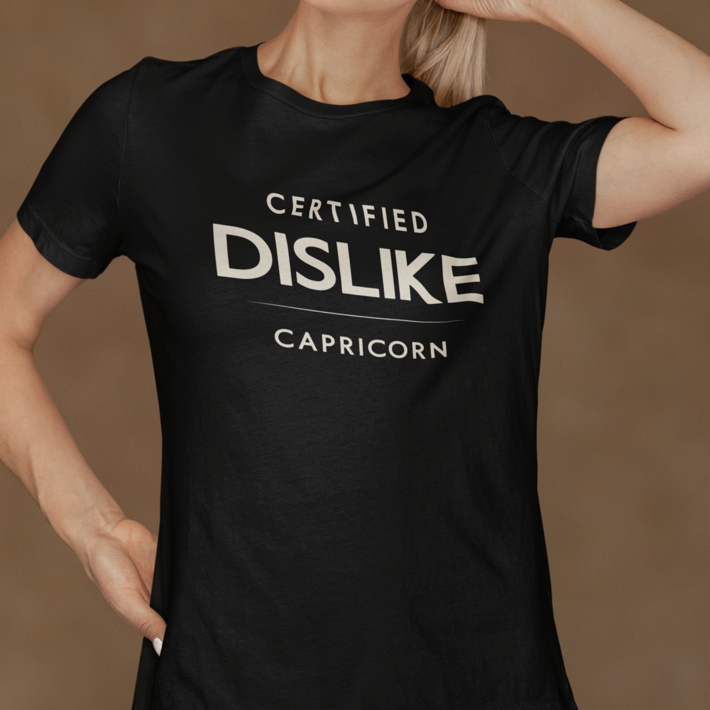Model wearing Capricorn zodiac t-shirt with Certified Dislike typography on black tee