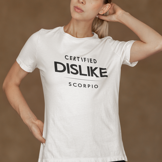 Model wearing Scorpio zodiac t-shirt with Certified Dislike typography on white tee