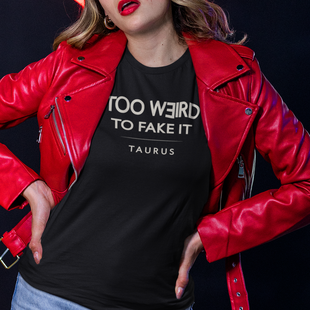 Model wearing Taurus zodiac t-shirt with “Too Weird to Fake It” typography quote design