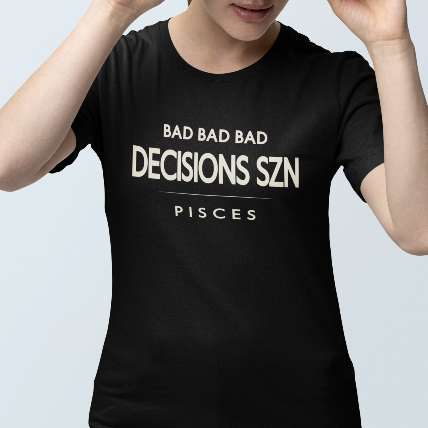 Model wearing Pisces zodiac t-shirt with “Bad Bad Bad Decisions SZN” typography quote