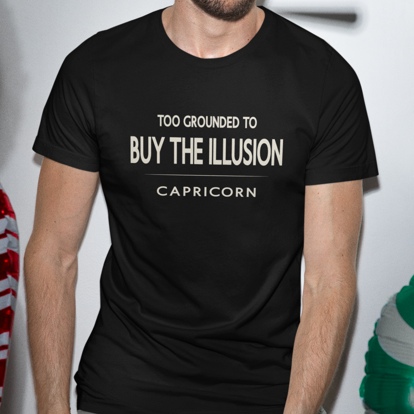 Model wearing Capricorn zodiac t-shirt with “Too Grounded to Buy the Illusion” typography quote