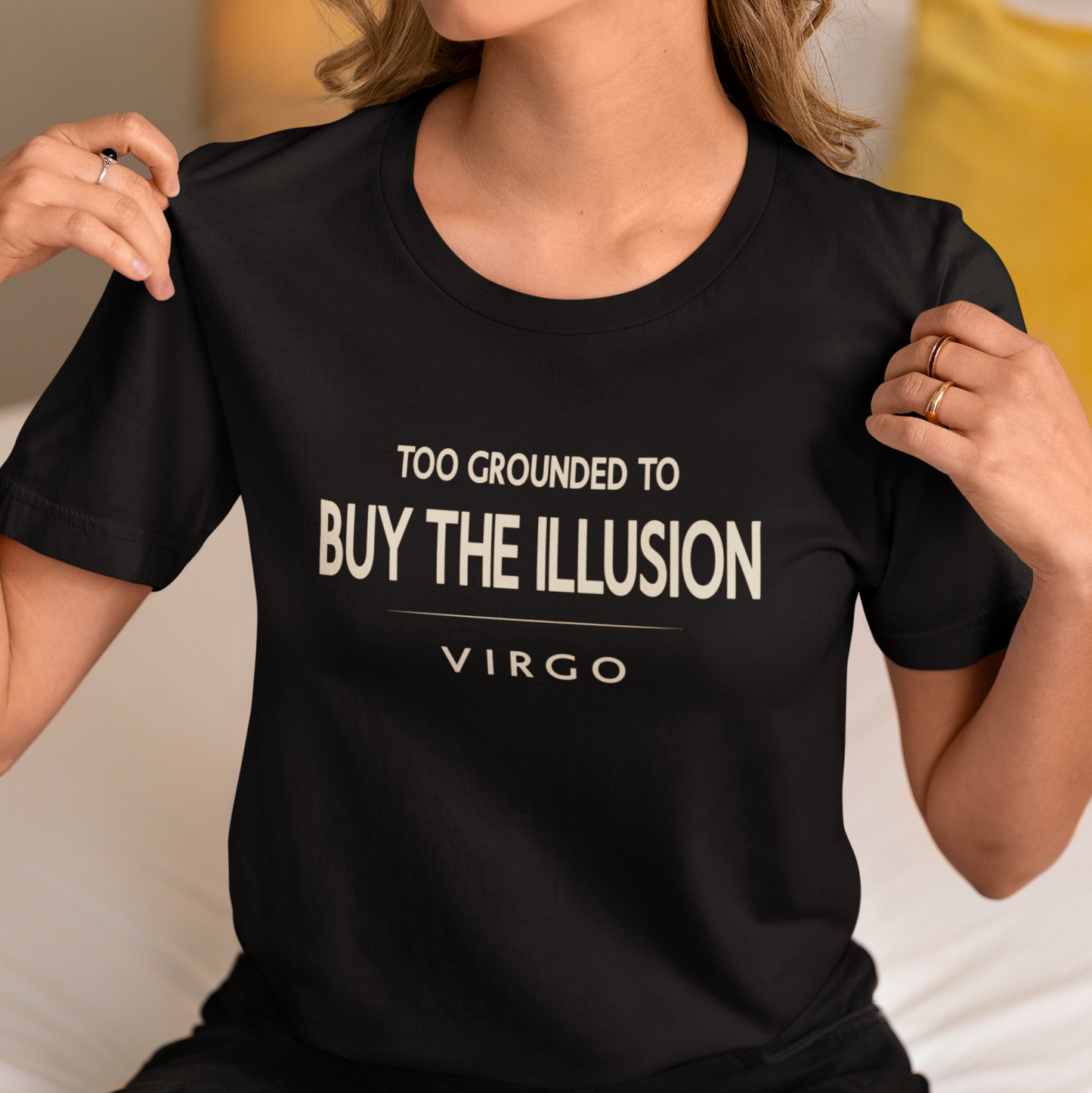 Model wearing Virgo zodiac t-shirt with “Too Grounded to Buy the Illusion” quote