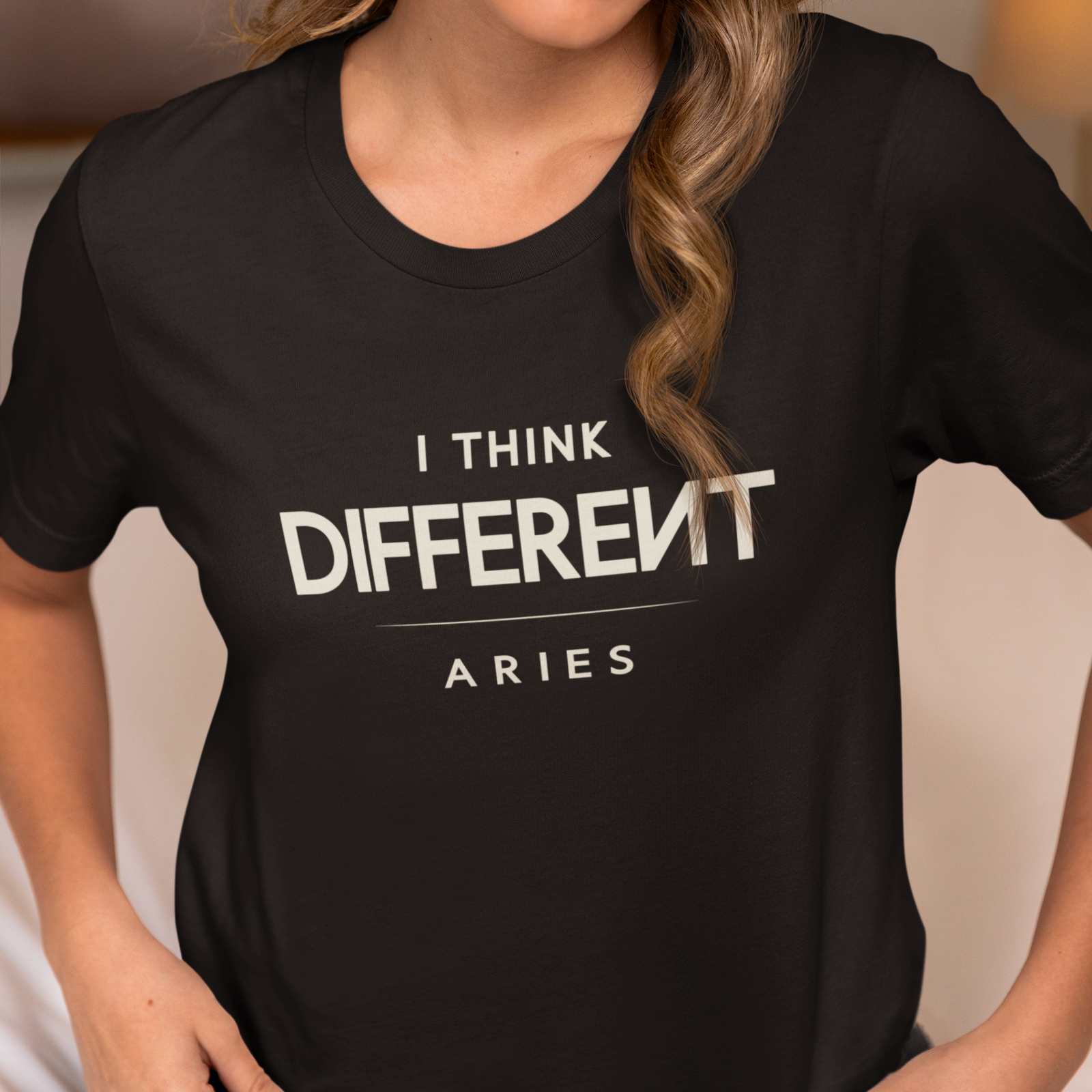 Model wearing Aries zodiac t-shirt with “I Think Different” typography quote design