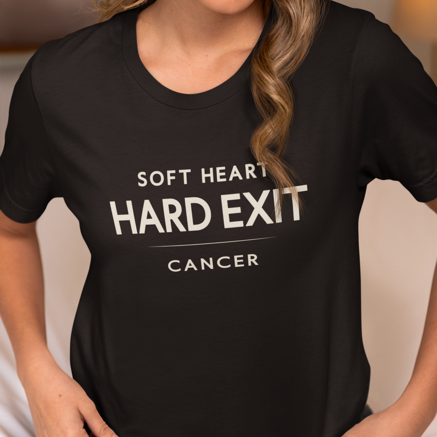 Model wearing Cancer zodiac t-shirt with “Soft Heart Hard Exit” typography quote