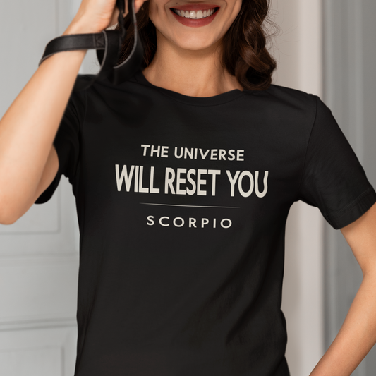 Model wearing Scorpio zodiac t-shirt with The Universe Will Reset You typography.