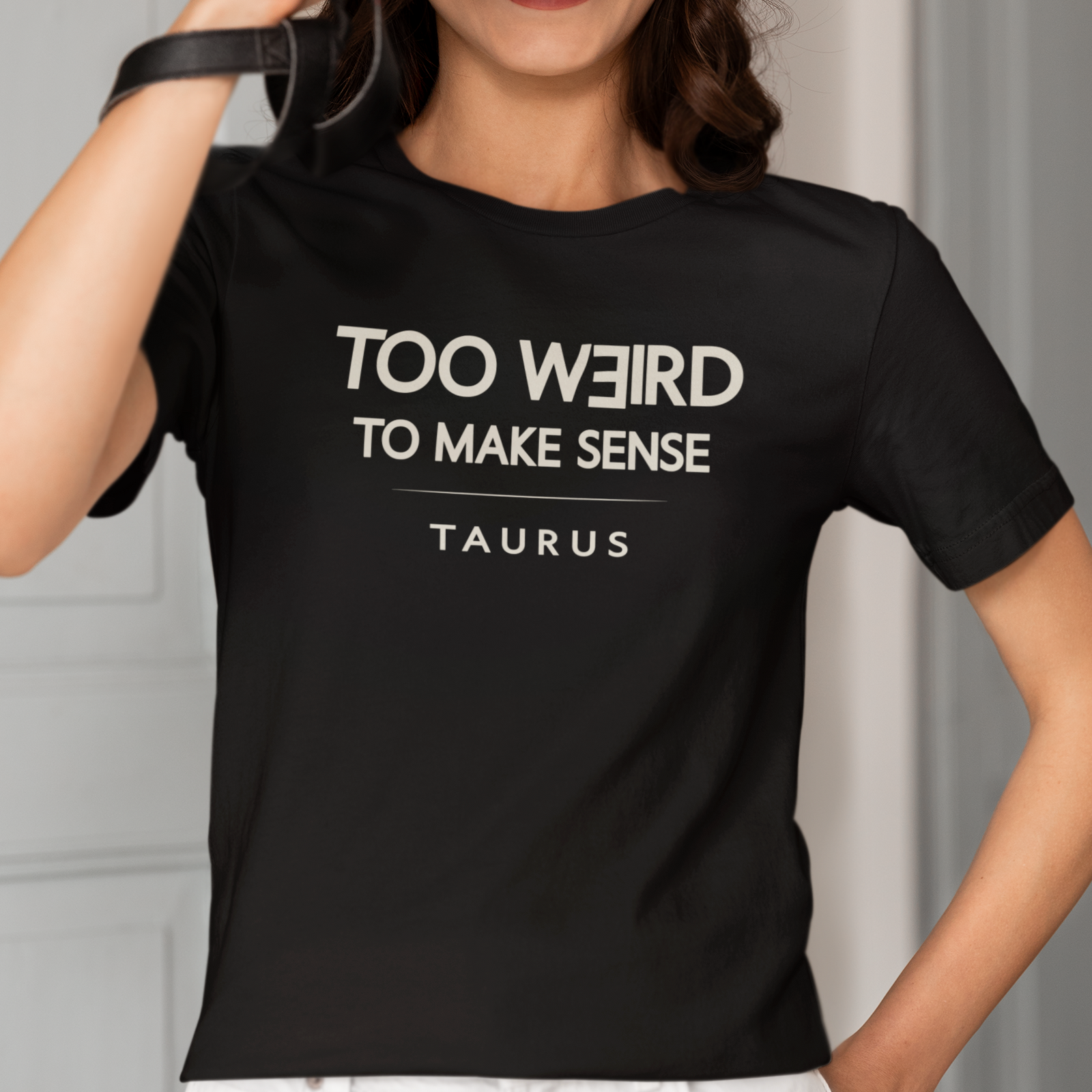 Model wearing Taurus zodiac t-shirt with “Too Weird to Make Sense” typography quote