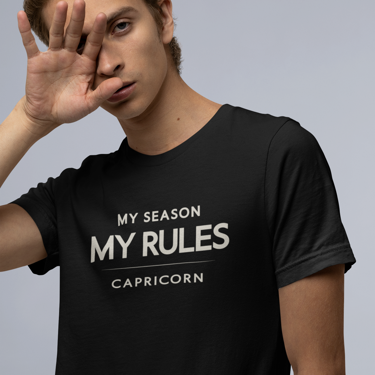 Model wearing Capricorn zodiac t-shirt with “My Season My Rules” typography quote design