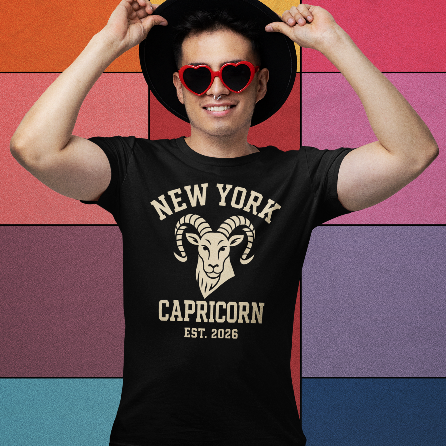 Man wearing a black New York Capricorn T-shirt with a vintage ram logo