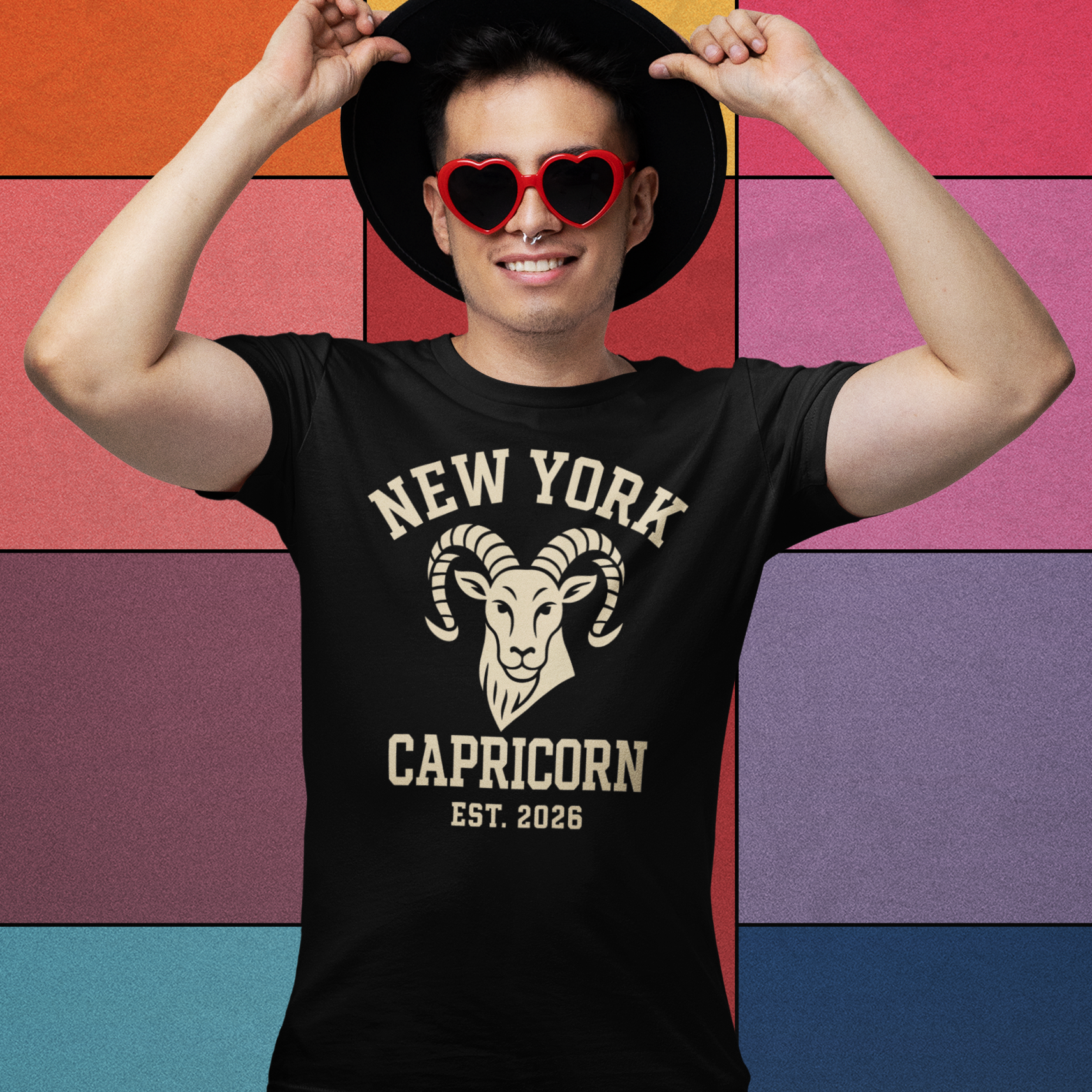 Man wearing a black New York Capricorn T-shirt with a vintage ram logo
