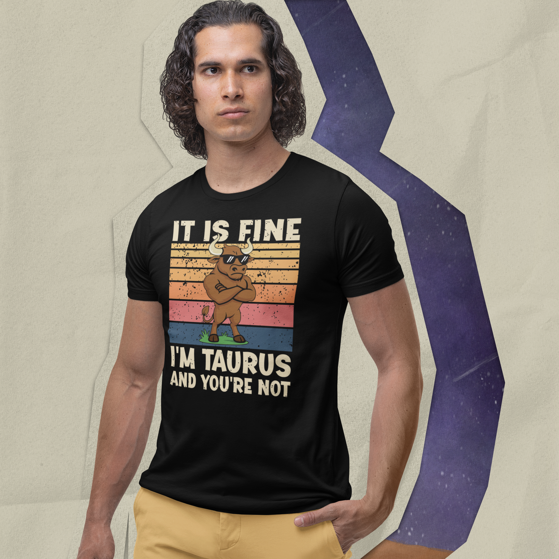Man wearing a black Taurus Attitude T-Shirt with retro bull design, standing against a textured zodiac-themed background.