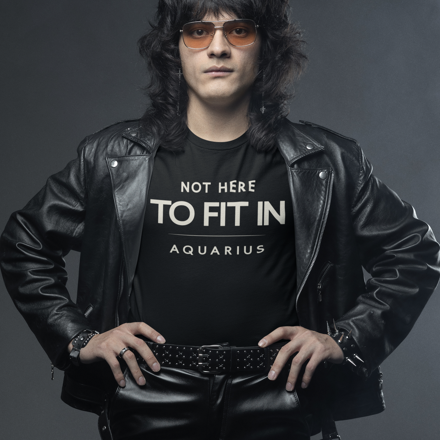 Model wearing Aquarius zodiac T-shirt with not here to fit in quote design.