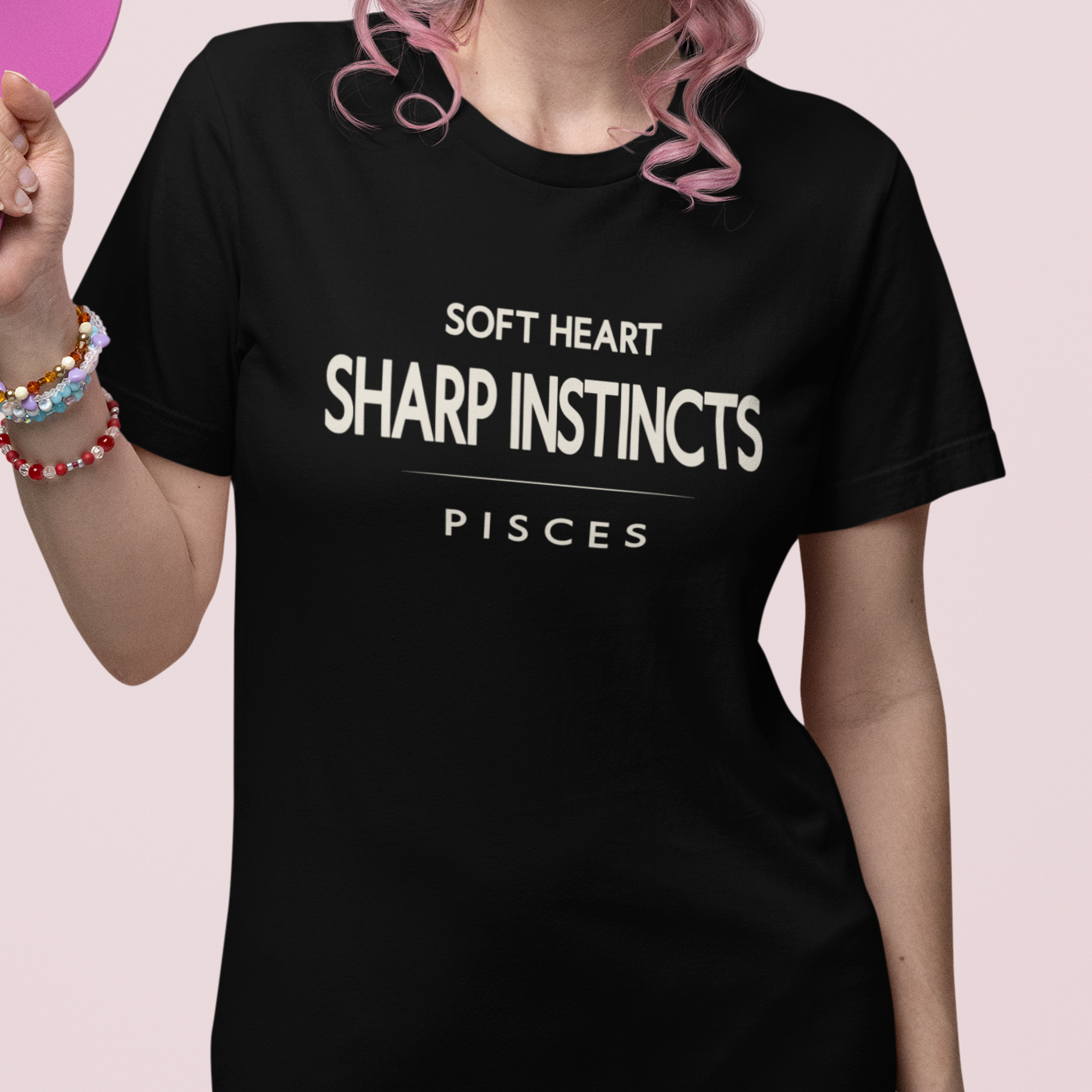Model wearing Pisces zodiac t-shirt with “Soft Heart Sharp Instincts” typography quote
