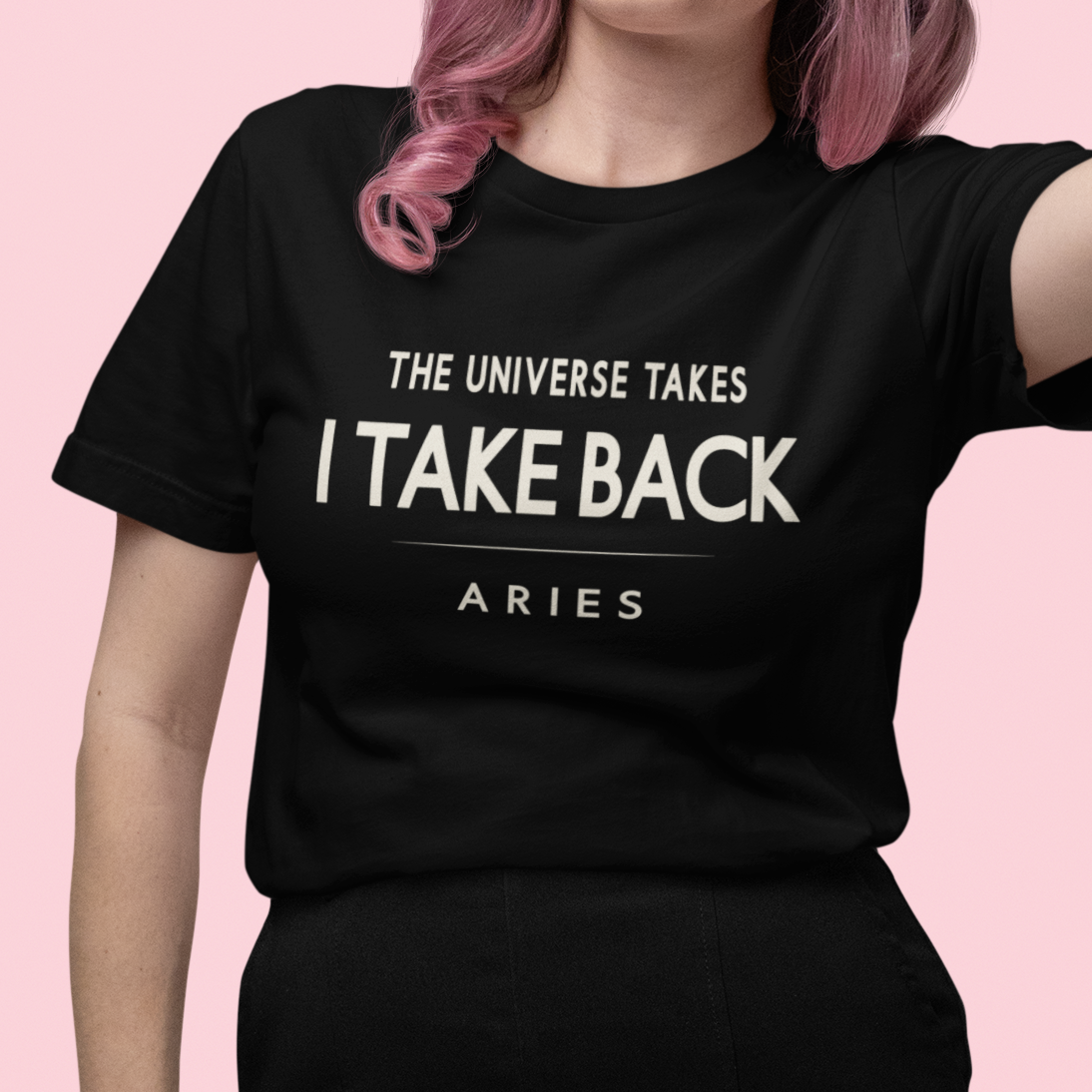 Model wearing Aries zodiac t-shirt with “The Universe Takes, I Take Back” bold typography quote design