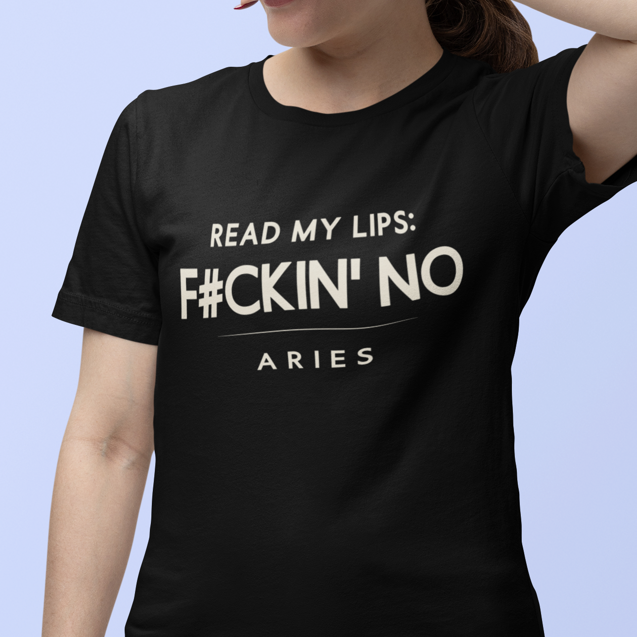 Model wearing black Aries zodiac t-shirt with “Read my lips F#ckin’ no” bold typography quote, hand covering face