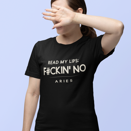 Model wearing black Aries zodiac t-shirt with “Read my lips F#ckin’ no” bold typography quote, hand covering face