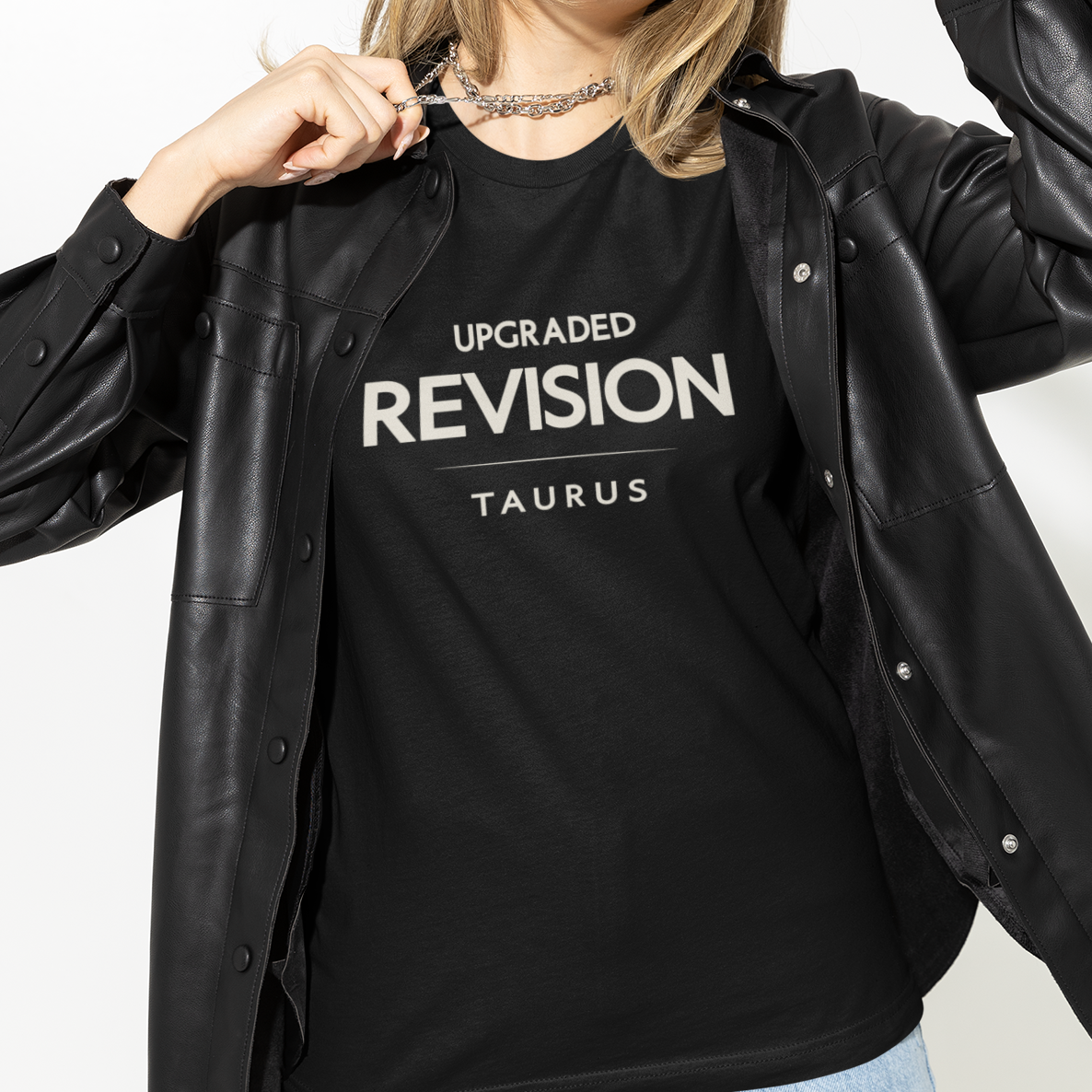 Model wearing Taurus zodiac t-shirt with “Upgraded Revision” typography quote