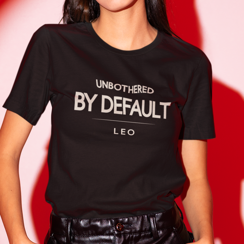 Model wearing Leo zodiac t-shirt with “Unbothered by Default” typography quote design