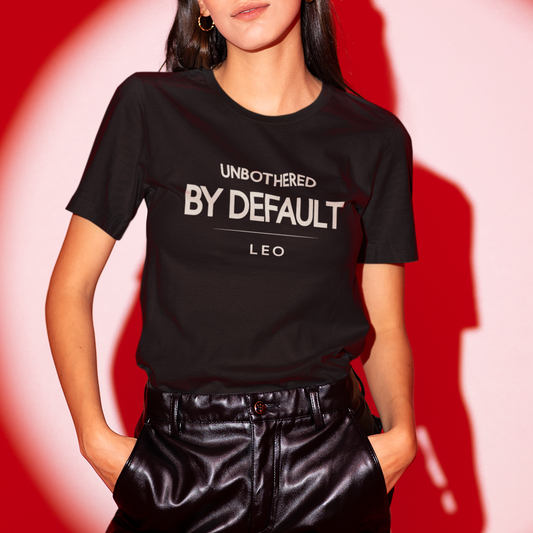 Model wearing Leo zodiac t-shirt with “Unbothered by Default” typography quote design