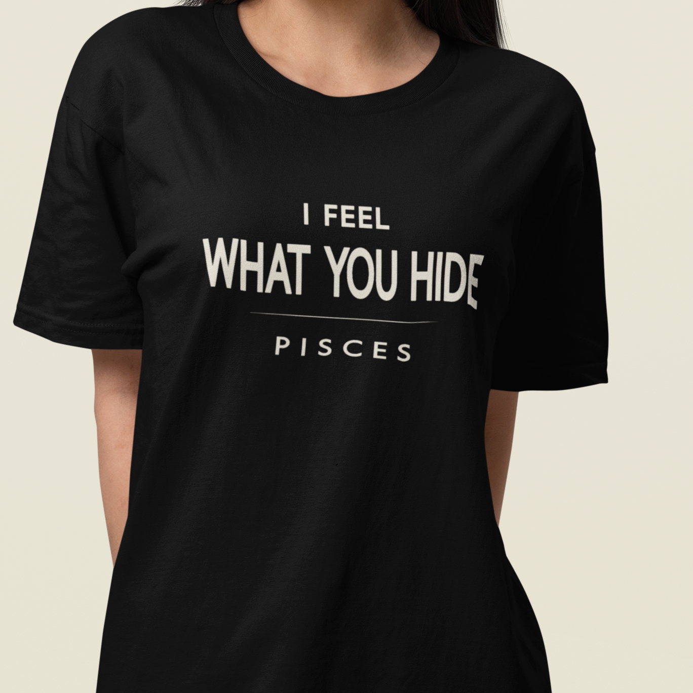 Model wearing Pisces zodiac t-shirt with “I Feel What You Hide” typography quote