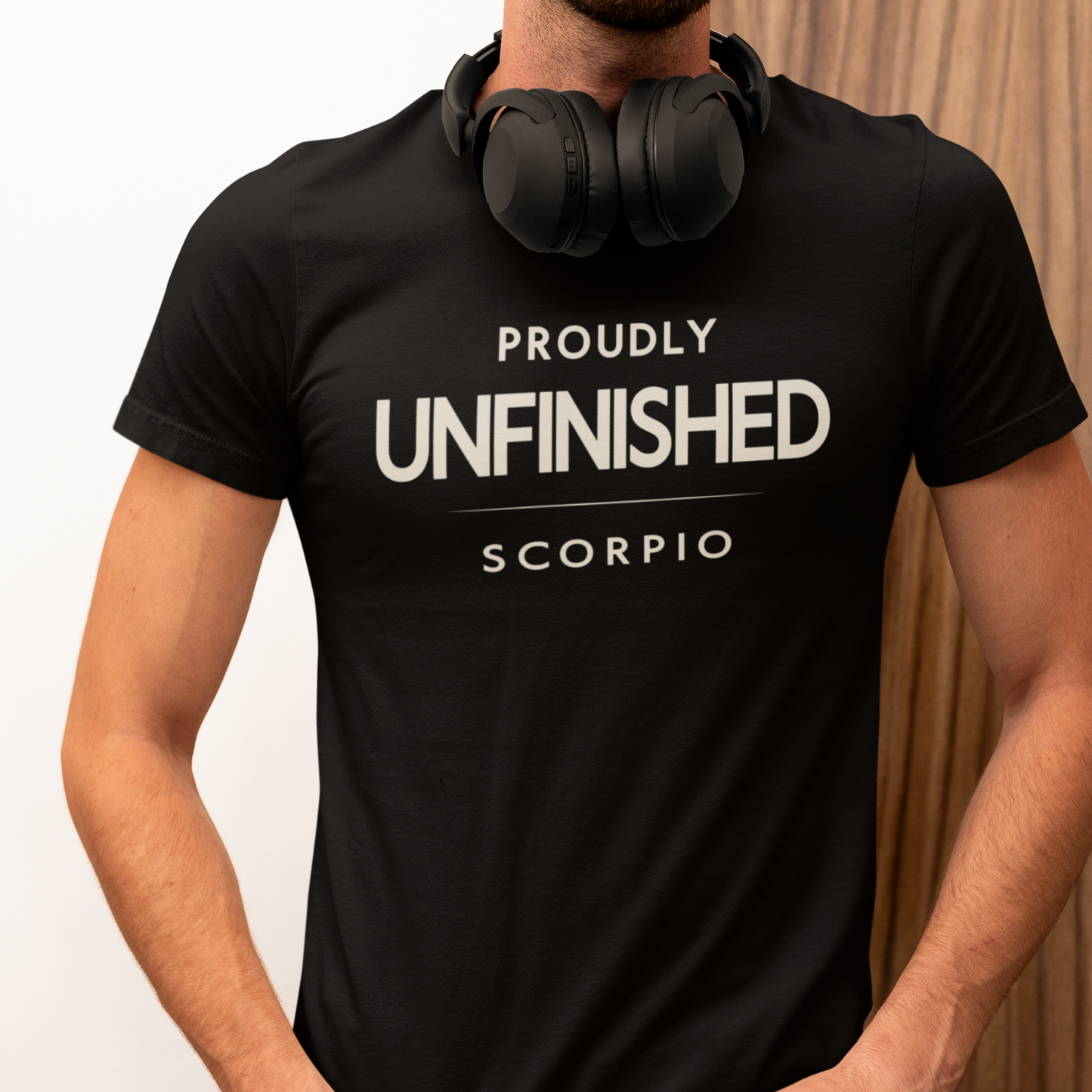 Model wearing Scorpio zodiac t-shirt with “Proudly Unfinished” typography quote design