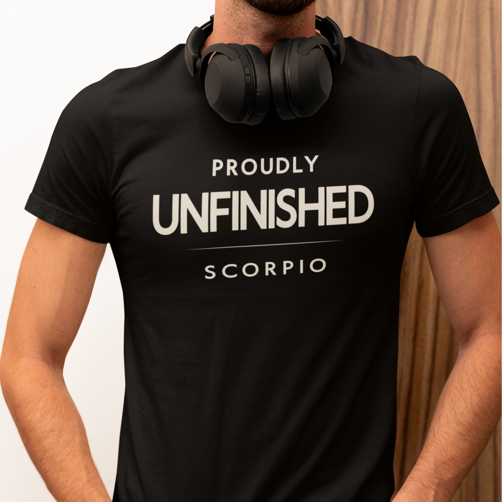 Model wearing Scorpio zodiac t-shirt with “Proudly Unfinished” typography quote design