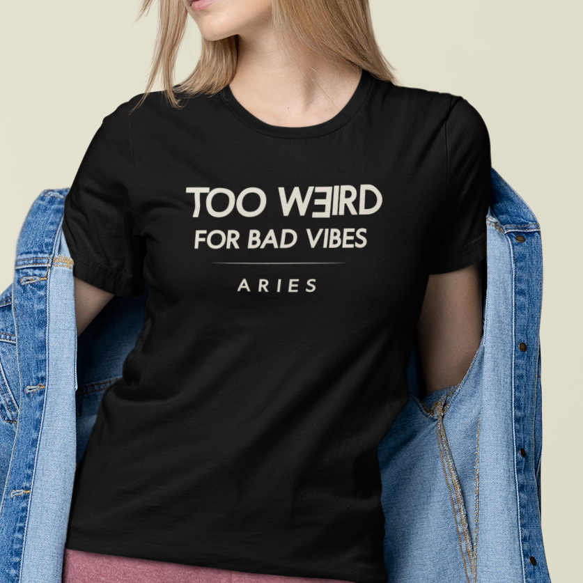 Model wearing Aries zodiac t-shirt with “Too Weird for Bad Vibes” typography quote design